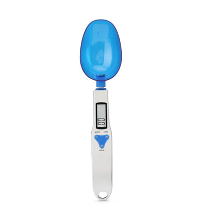 White digital measuring spoon scale with LCD display measuring spices, featuring three different interchangeable spoon sizes.